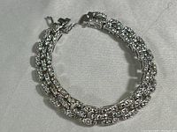 Double row sterling silver bracelet with cubic zirconia stones arranged in rectangular links, showing overall design and size.