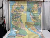 Full view of laminated California map including Bay Area and Los Angeles insets spread out vertically on a white background.