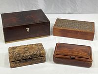 Overview of all four wooden boxes showing size and shape differences along with surface details