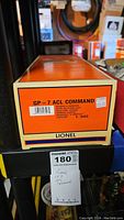 Photo of orange and cream Lionel box showing detailed product label for GP 7 ACL Command locomotive, item number 6-28503, price tag showing $325.00