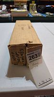 Original cardboard box labeled 'New York Central 2354' with auction tag.