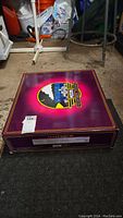 Closed purple MTH Electric Trains F-3 A-B-A Diesel Set box lid with logo