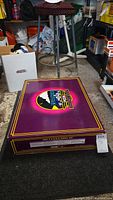 Top of unopened purple MTH box with logo and set name printed on lid