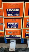 Stack of three Lionel Electric Trains boxes showing the model names and numbers for S.P. Daylight Aluminum Vista Dome Car, Great Northern Vista Dome Car, and Lionel Lines Aluminum Baggage Car.