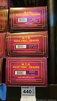 Boxes showing Heinz Happy Holidays 1869, Lehigh Valley caboose, and Amtrak freight car model titles and MTH Electric Trains branding.