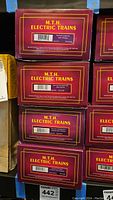 Stack of M.T.H. Electric Trains boxes showing multiple lot items