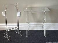 Rack and tray table displayed side by side against wall