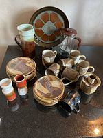 Overall view of all pottery pieces on countertop