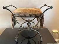 Front angle showing full bench and cushion on top of black surface