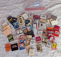Top view of mixed vintage and new matchbooks and matchboxes from different brands and places including East Coast, Las Vegas, Reno