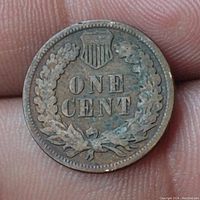 Reverse side of 1891 Indian Head penny showing wreath, shield and denomination 'ONE CENT'
