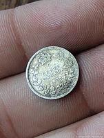 Reverse side of 1905 Canadian 5 cent coin with crown and wreath design and denomination text.