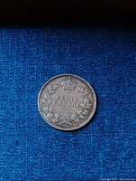 Reverse of 1919 Canadian 5 cent silver coin showing denomination, year, crown and wreath design