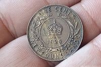 Close-up of the 1929 Newfoundland large cent coin front side showing crown, date, and inscriptions.