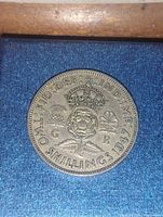 Close-up image of the 1947 England 2 Shillings coin showing the crown, rose, thistle, shamrock, and inscriptions.