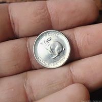 Reverse side of 1967 Canadian Rabbit nickel showing detailed rabbit engraving and centennial dates.