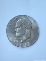 Obverse side of the 1978 Eisenhower US dollar coin showing Dwight D. Eisenhower's profile and inscriptions.
