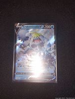 Photo of a Crabominable V holographic full art Pokemon card showing front side with foil shine and card details.