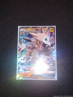 Close-up image of Lycanroc GX full art holofoil Pokemon card, showing detail of the artwork, HP 200, attacks: Crunch, Accelerock, Lycanroc GX