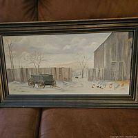 Front view of framed Barnyard painting by Emmons showing farm scene with wagon, barn, fence, and chickens in snow.