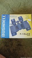 Photo of original box for Bushnell PowerView binoculars, with branding and product details visible on packaging