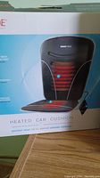Box of Obusforme heated car cushion showing product image and features