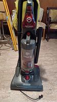 Front view of the Dirt Devil Jaguar Pet upright vacuum cleaner showing the pet hair turbo brush attachment and hose.