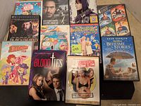 Photo of 12 DVDs including Blackbeard, Sherlock Holmes, Barbie, Justin Bieber, Superman, and others