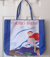 Full view of Harper's Bazaar canvas tote bag with blue sides and vintage magazine cover print.