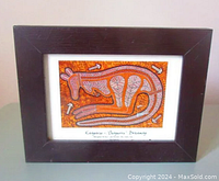 Photo of the full framed artwork showing the kangaroo in earthy traditional Aboriginal style on orange-brown background.