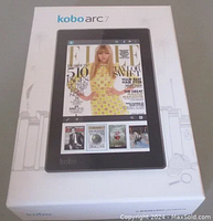 Front view of the Kobo Arc 7 box showing the tablet and digital magazine cover on screen.