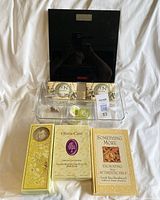 GNC black digital scale with soap boxes and aromatherapy bath products in front, drawer organizer beneath