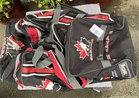 Canada logo hockey bag lying on its side showing the logo and handles