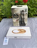 Boxed lever-style wine bottle opener showing external packaging.