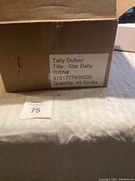 Box labeled with Tally Dufour, Star Baby, ISBN and quantity 48 books.