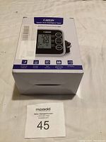 Photo of the front of the box showing the product image, model, and features