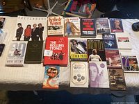 Photo of the entire lot laid out on a bed including a mix of books and CDs