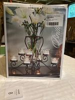 Box shows Brilliance Collection 10-piece centerpiece including metal chandelier holder and glass vase.