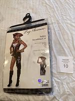 Full front view of the sealed Leg Avenue Sultry Swashbuckler costume packaging showing the model, brand and costume details