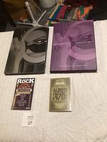 Overview of full lot with Prince book, CD, two rock music books