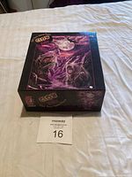 Closed puzzle box showing Glow in the Dark design with wolves, moon, and bear