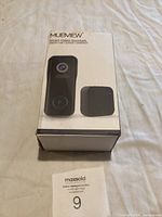 Front of the product box showing the MUBVIEW smart video doorbell and a base unit.