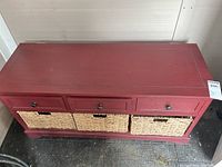 Front view showing three drawers above three wicker baskets