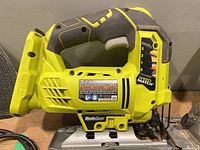 Ryobi cordless jig saw showing ergonomic handle and speed setting dial