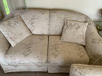Full view of Sklar Peppler love seat with floral upholstery and two cushions showing condition and style.