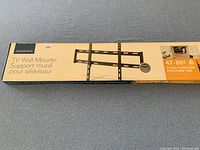Box of Insignia brand TV wall mount labeled for 47 to 80 inch TVs, showing brand and product details