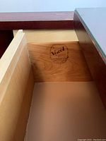 Close-up of the drawer interior showing the Viscol brand stamp on the side panel indicating maker and authenticity.