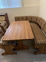 Front view showing full set: table, two chairs, L-shaped bench