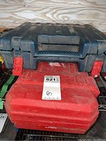 Stacked blue Bosch case with visible Bosch logo and red Milwaukee case beneath it, showing overall condition and branding