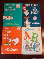 All four children's books laid out flat, showing covers: 'Are You My Mother?', 'The Cat in the Hat', 'Green Eggs and Ham', 'Dr. Seuss's ABC'.